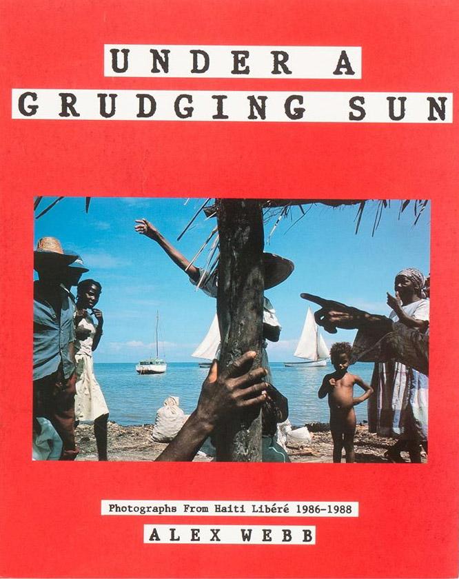 <em>Under a Grudging Sun: Photographs from Haiti libéré 1986-1988. </em>Thames & Hudson, 1989.
